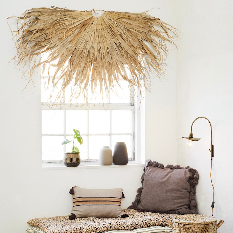 Palm wall hanging in half-sun style. Natural wall decor for Japandi, boho interiors